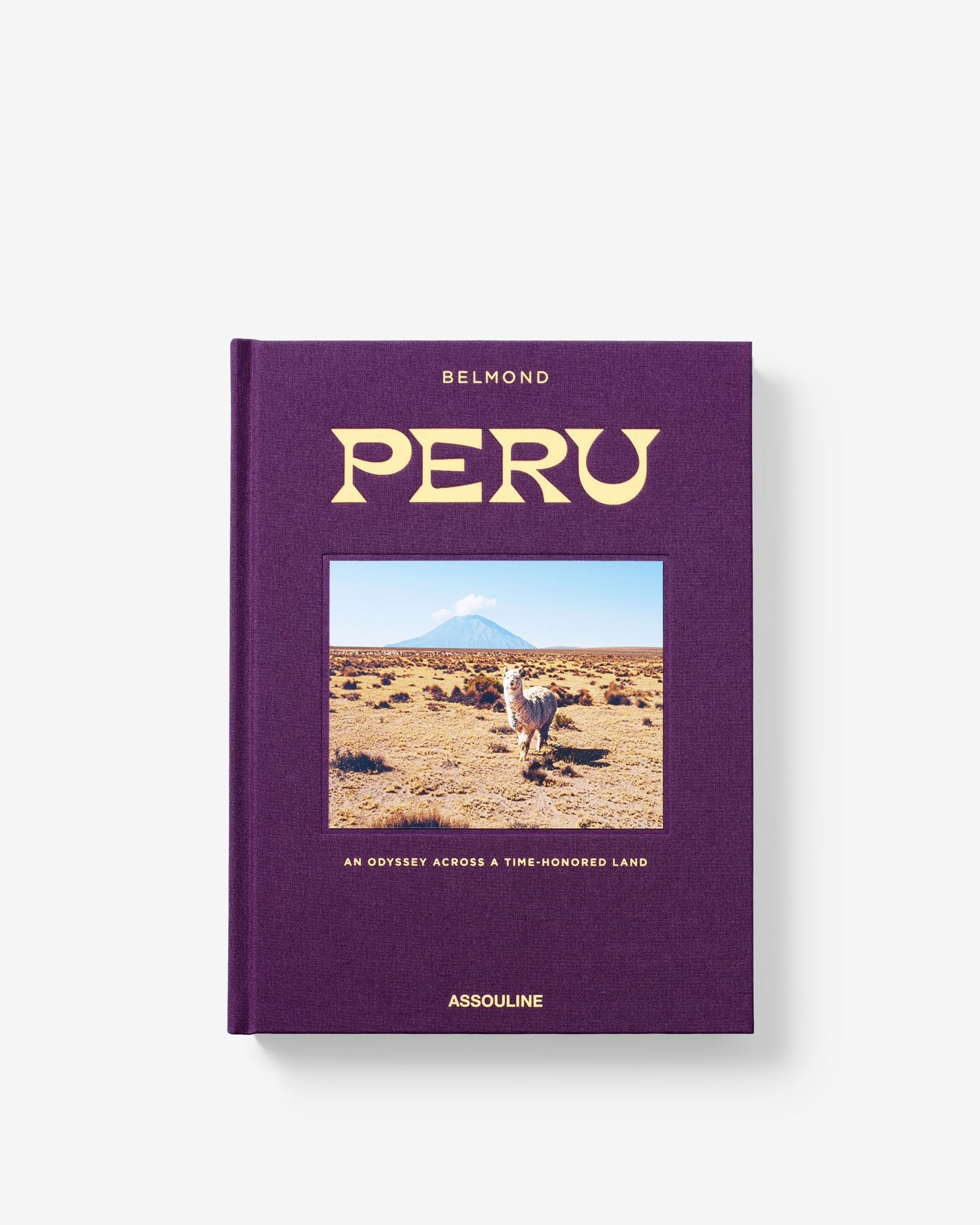 Libro de lujo Assouline Perú. Detalle de la cubierta morada con texto dorado y paisaje andino.