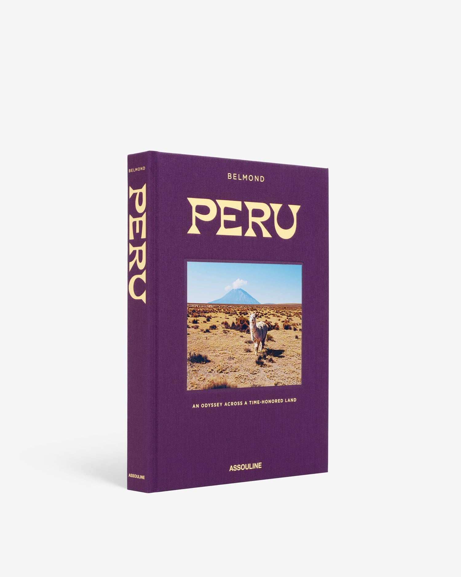 Libro decorativo Assouline Perú, fondo blanco. Cubierta morada con imagen de llama y montaña andina.