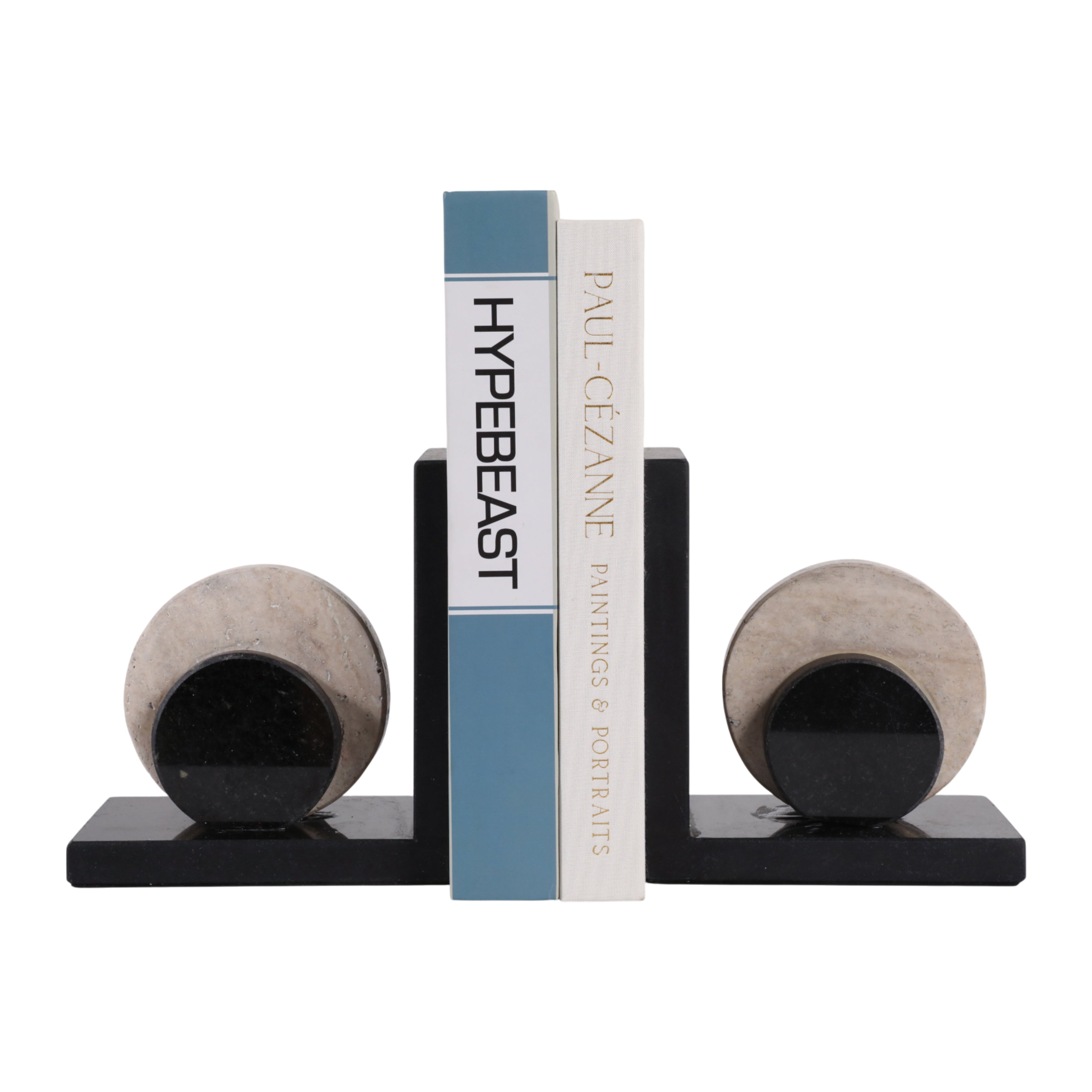 Elegantes sujetalibros de mármol negro y beige, con libros, en un ambiente minimalista y sofisticado.