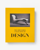 Libro Assouline The Impossible Collection of Design, cubierta amarilla y silla lounge plateada.