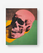 Portada del libro de lujo 'Andy Warhol: The Impossible Collection' de Assouline con diseño de calavera rosa vibrante.