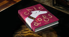 Libro decorativo Chic Dogs Assouline sobre mesa negra, ideal para coleccionistas.
