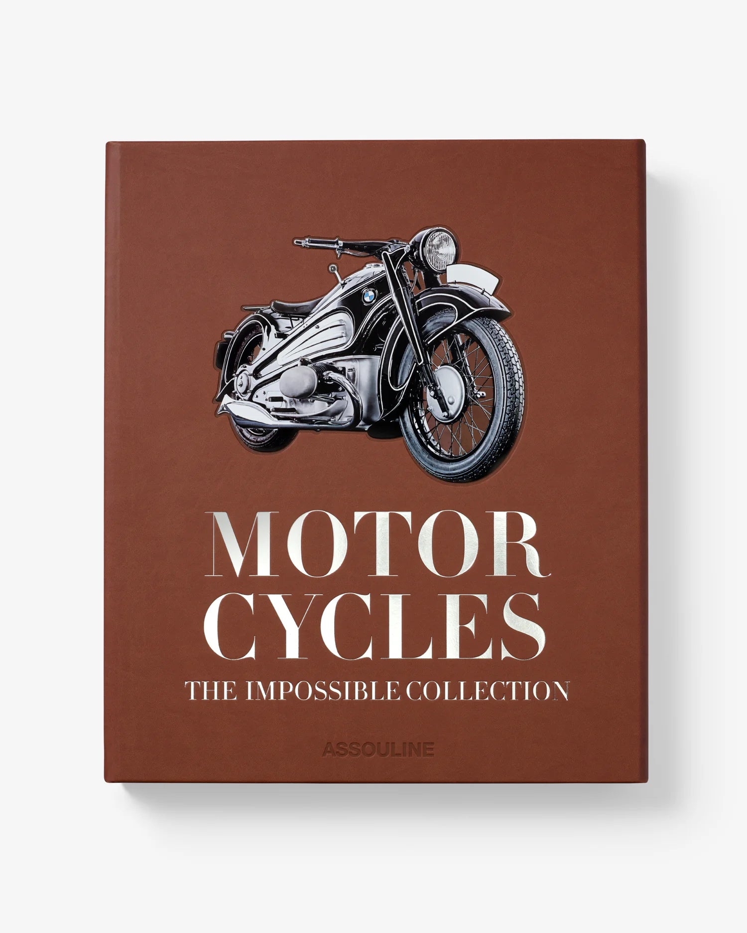 Libro de lujo Assouline Motorcycles The Impossible Collection sobre superficie plana, vista frontal.