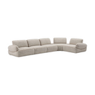 Sofá modular seccional de lujo color beige con tapizado texturizado y piping elegante.