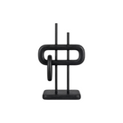 Escultura abstracta negra de diseño moderno y elegante, perfecta para decoración de interiores contemporáneos.