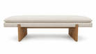 Banca Aster tapizada en tela beige claro con base de madera maciza, vista frontal y diseño moderno.